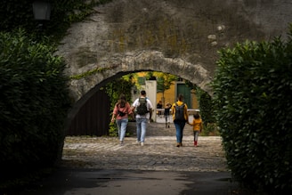 A group of people walking through a tunnel