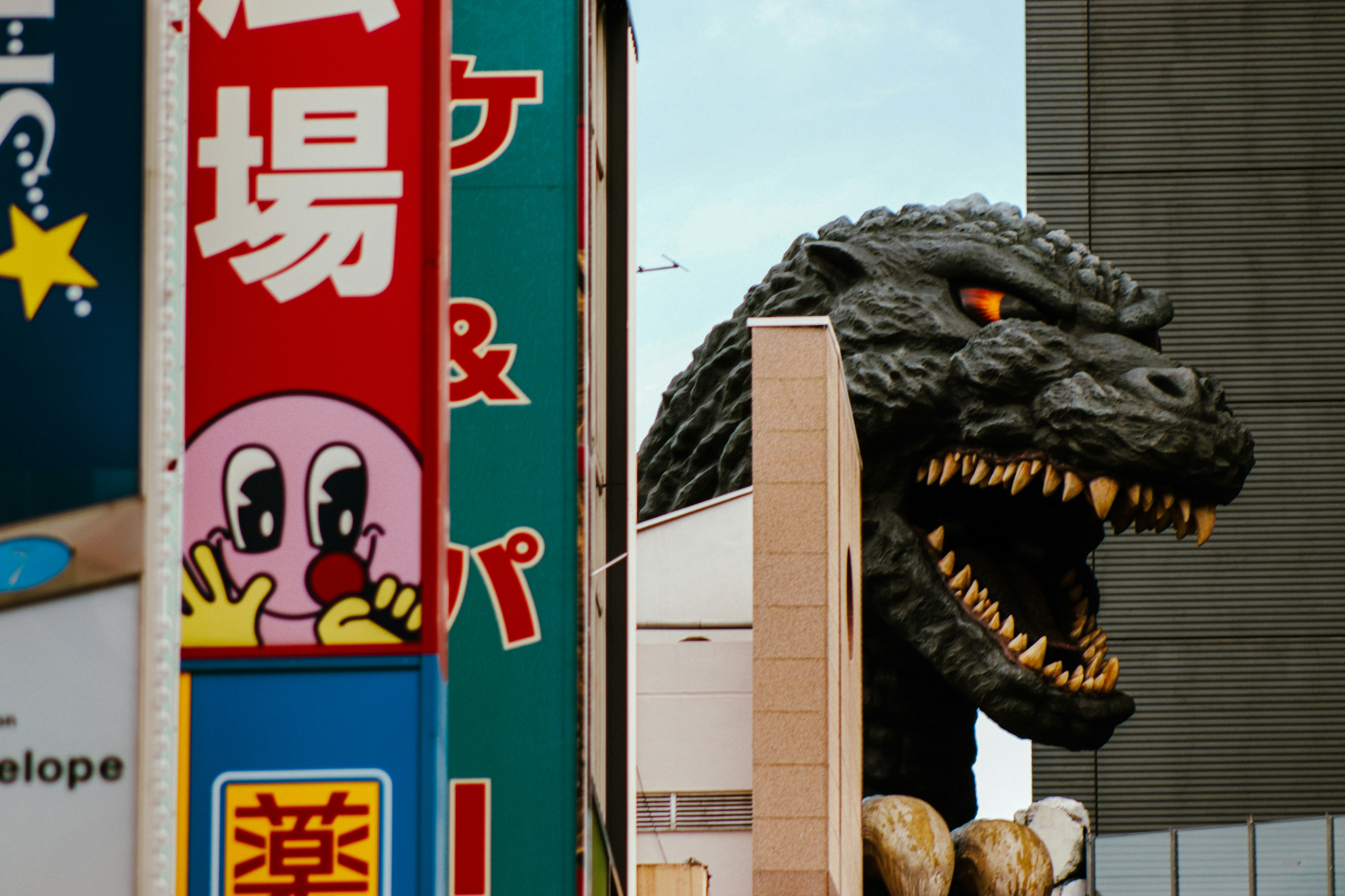 A statue of a dinosaur in front of a building