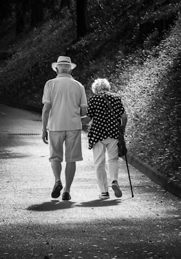 A man and a woman walking down a path