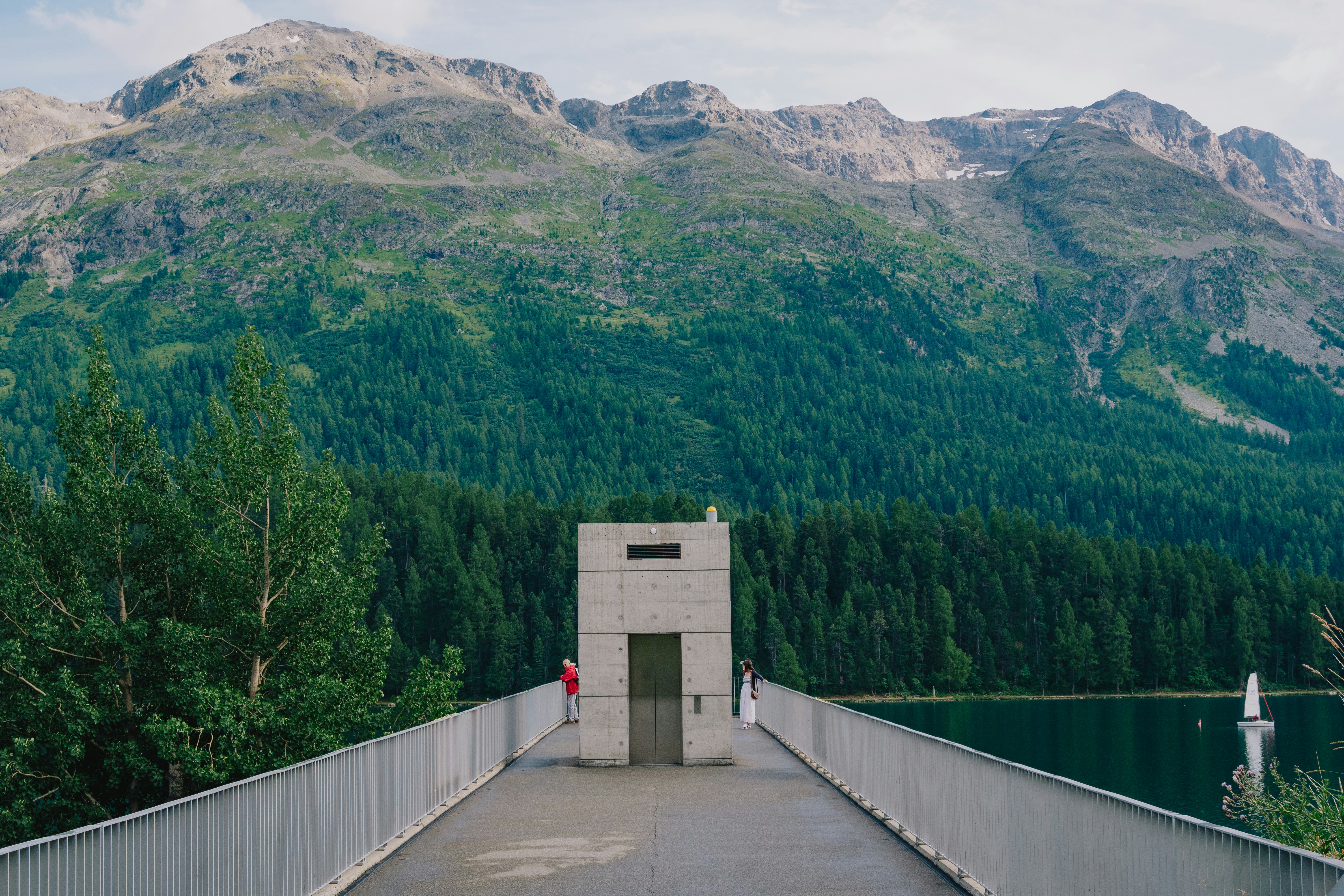 A view of a bridge with mountains in the background