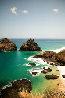 A view of a body of water with rocks in the foreground
