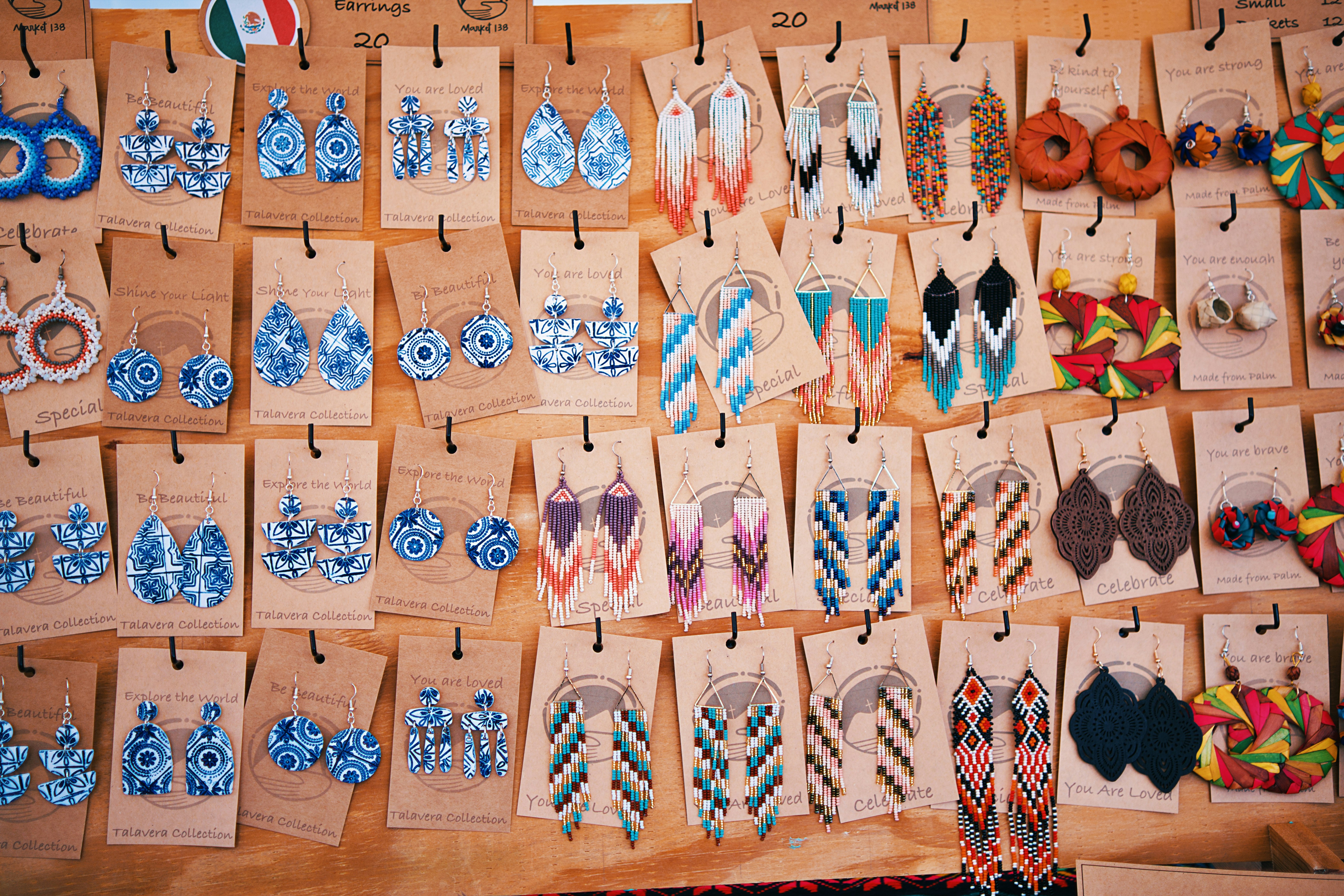 Wide, colorful variety of handcrafted Mexican Tile earrings provided by a family-owned business (Market138 on Etsy) and hosted at the 2024 Pineville Fall Festival. Market138's Etsy Shop: https://www.etsy.com/shop/market138/?etsrc=sdt