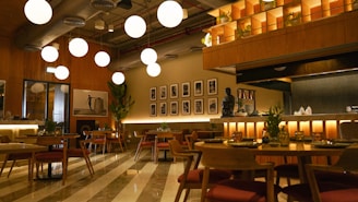 A restaurant with a lot of tables and chairs