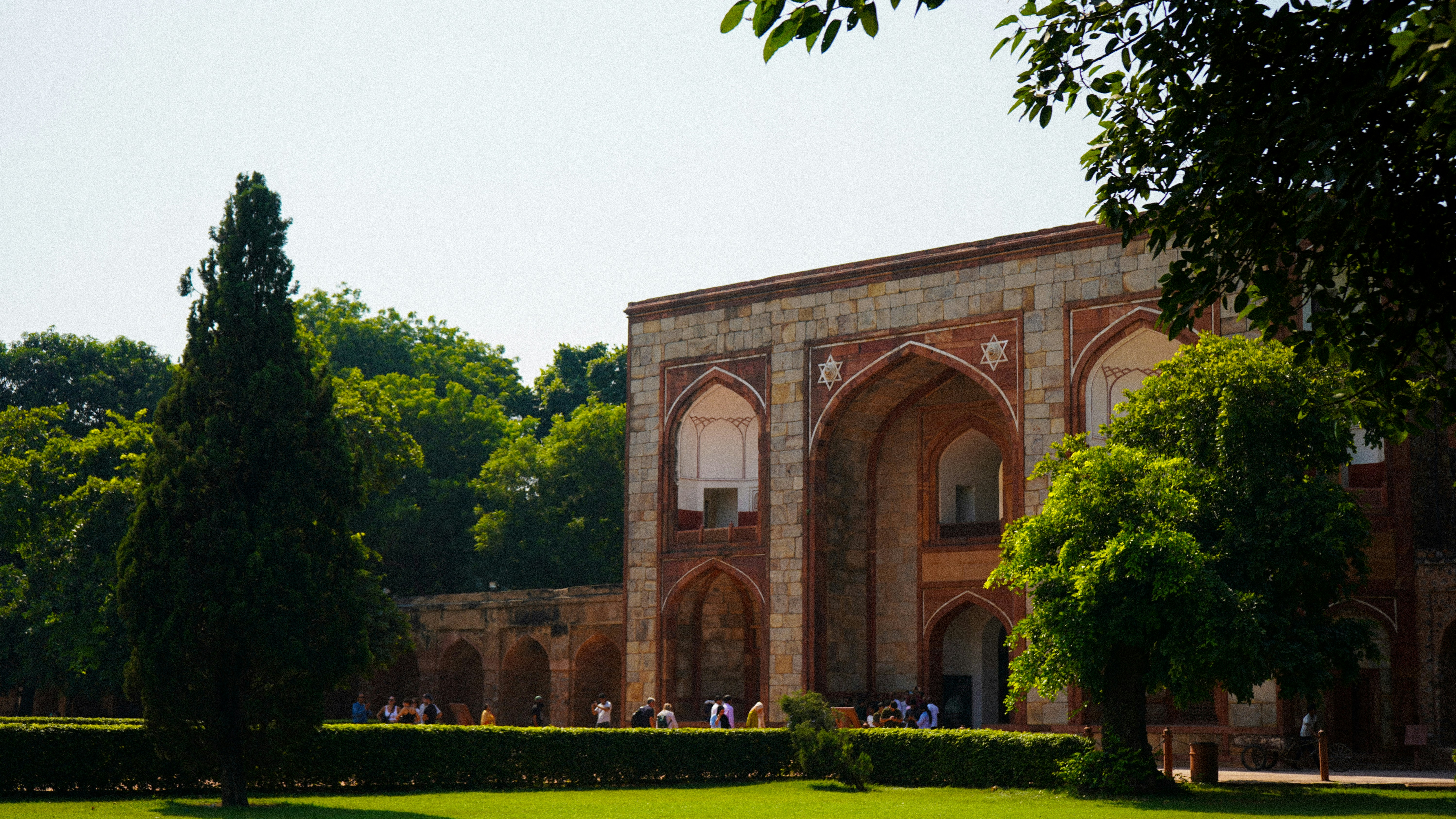 A large building with a large lawn in front of it