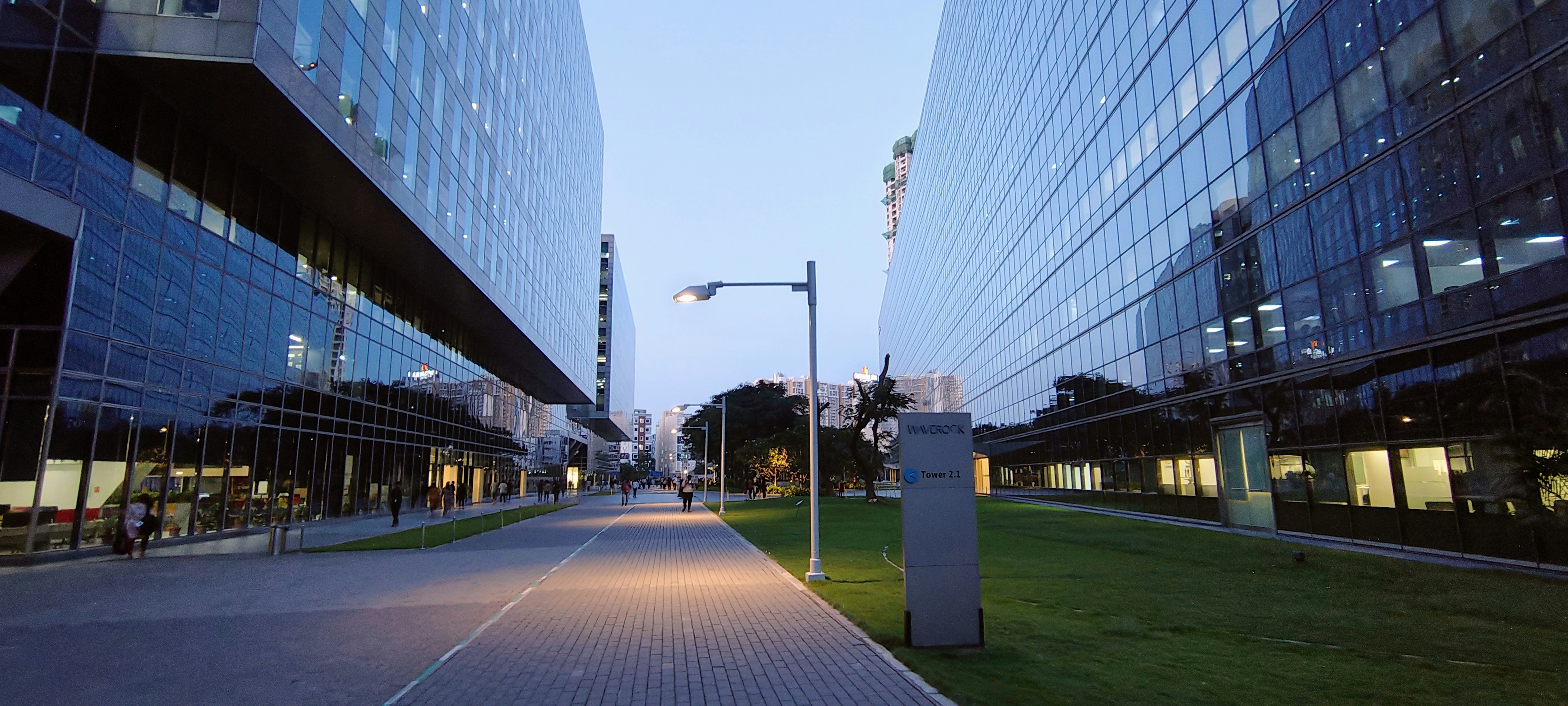 Bright modern office building entrance with clean paved walkway