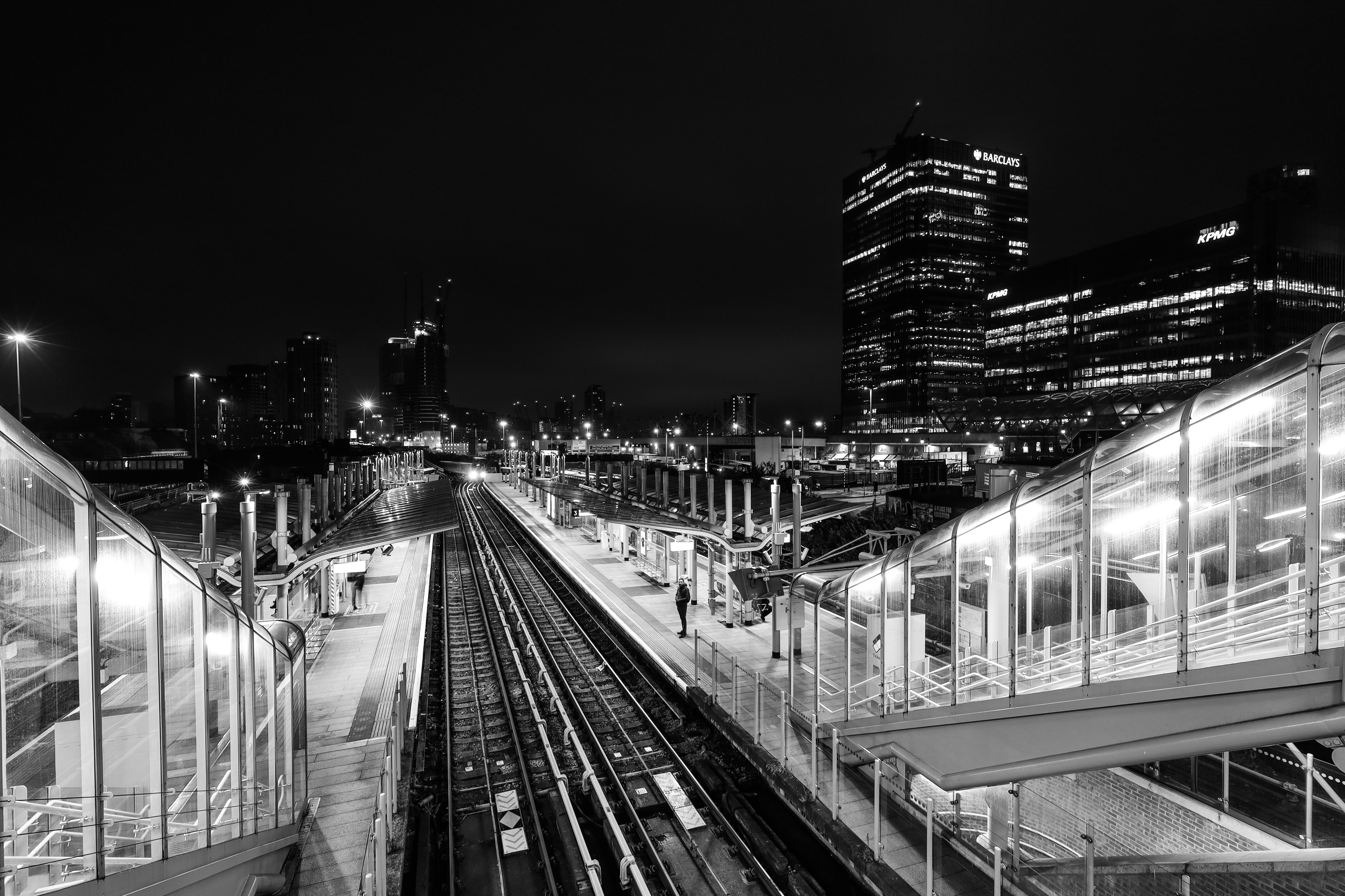 A black and white photo of a train station