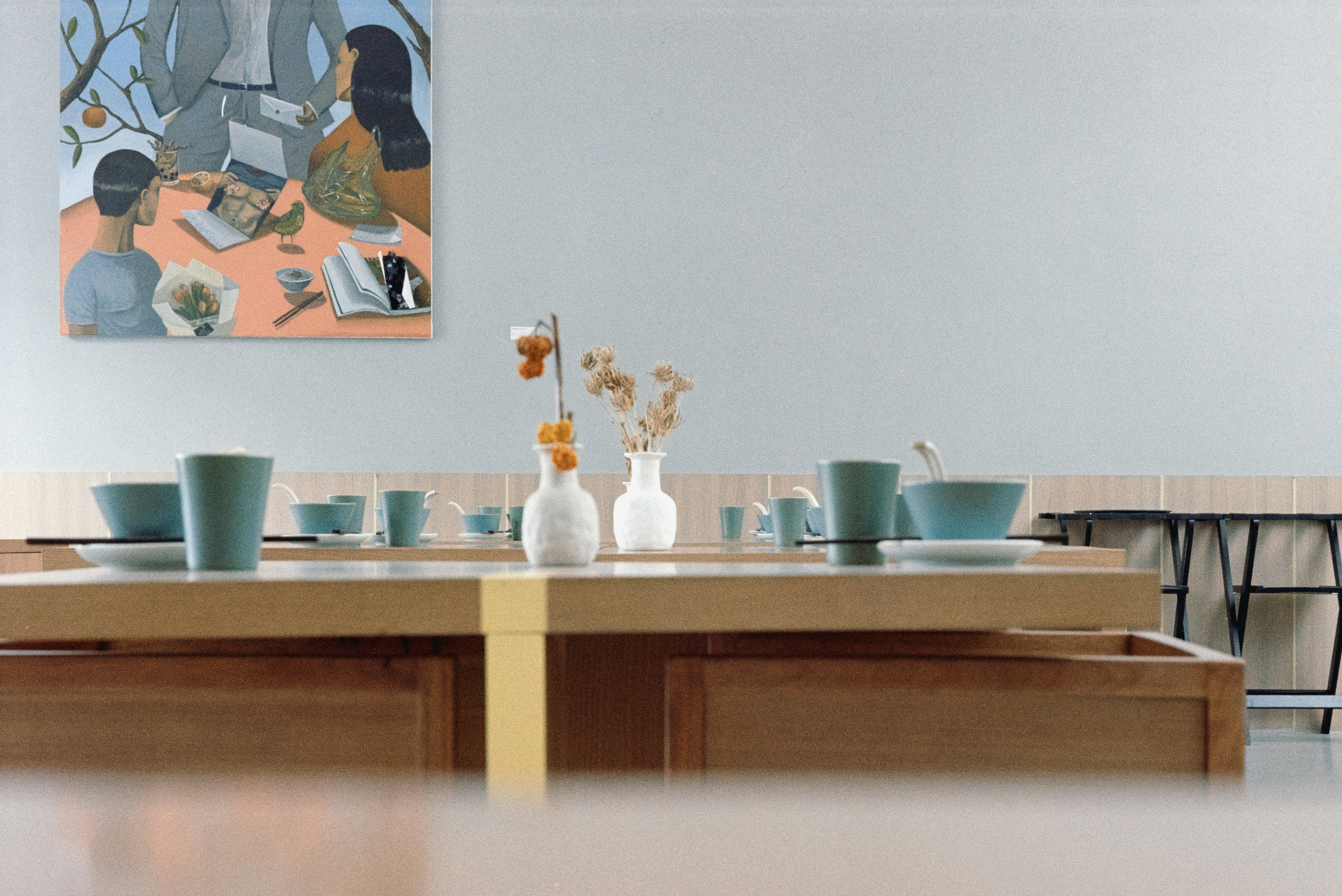 A dining room with a table and chairs