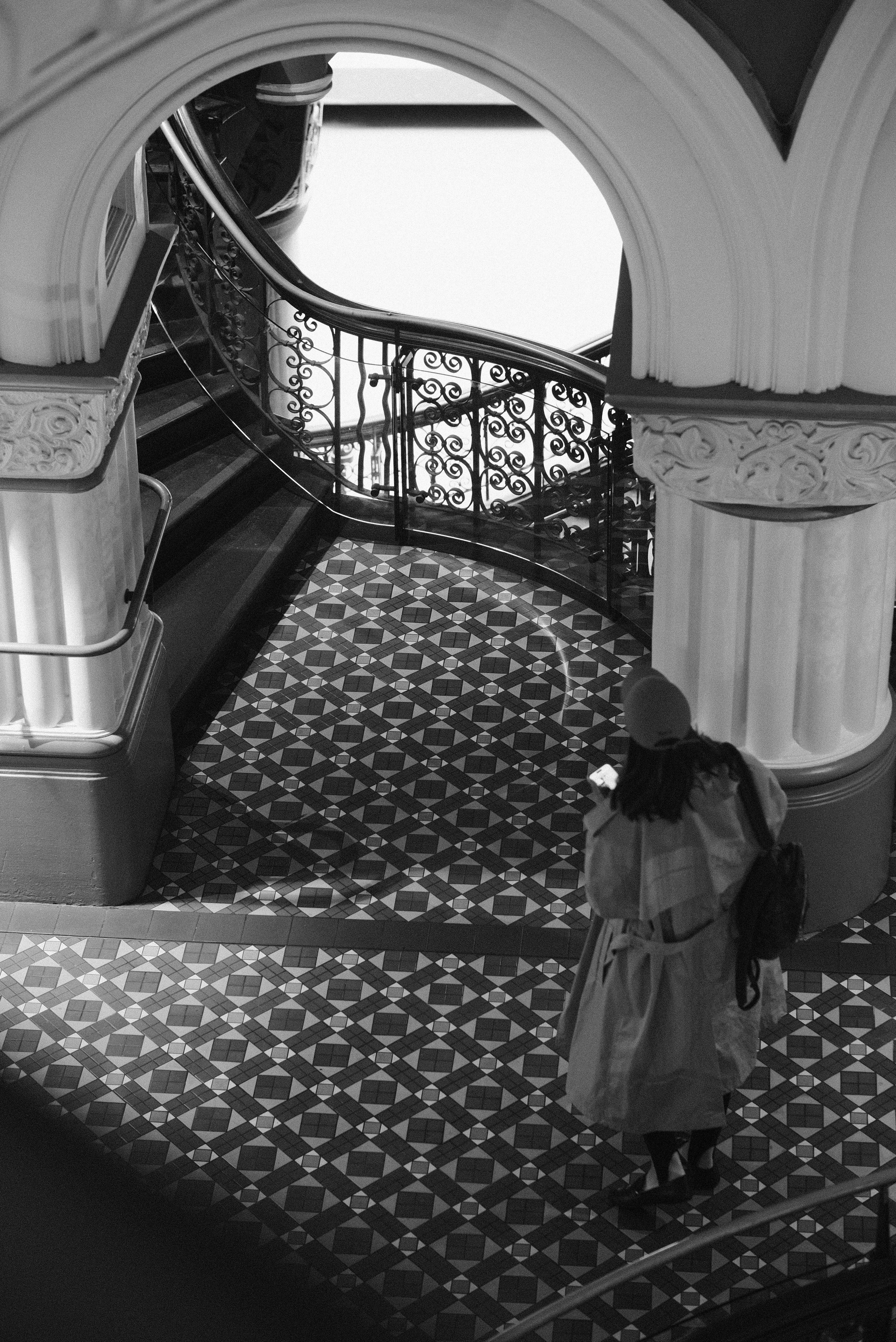 A woman walking down a set of stairs