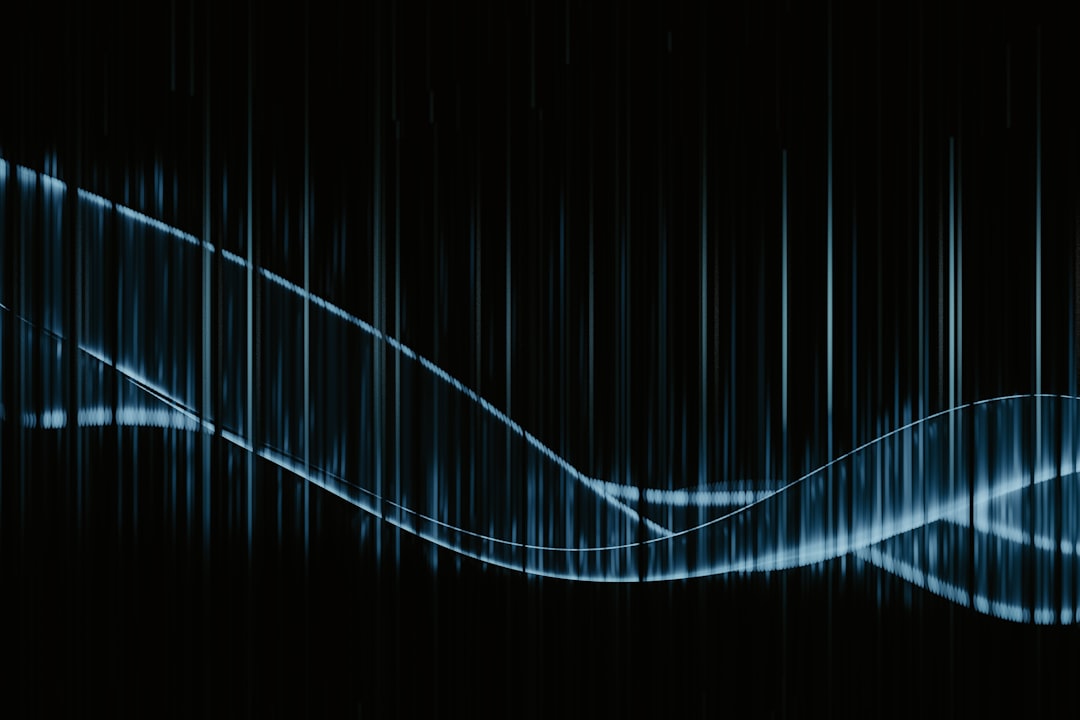 A black background with a blue wave on it,