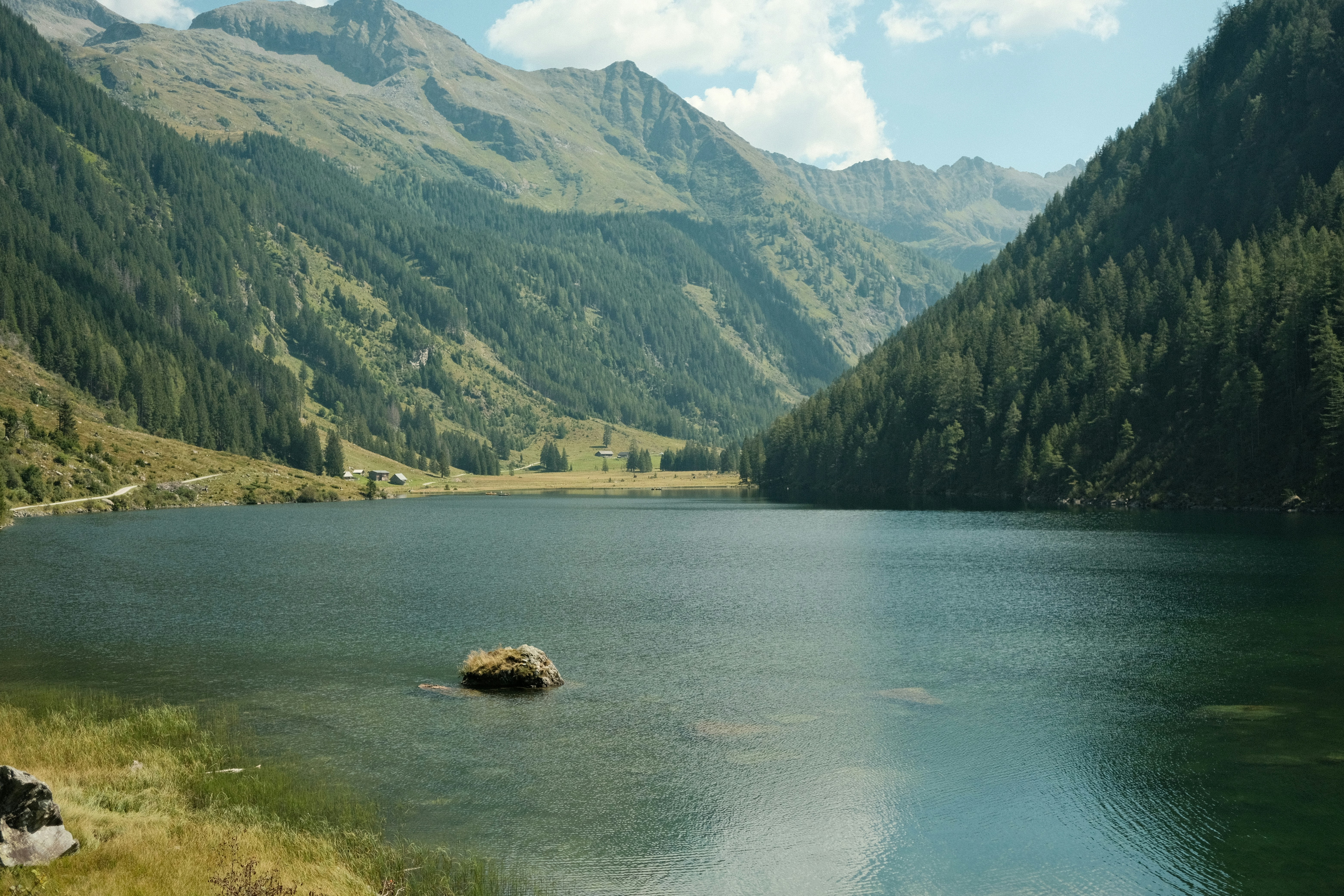 A large body of water surrounded by mountains