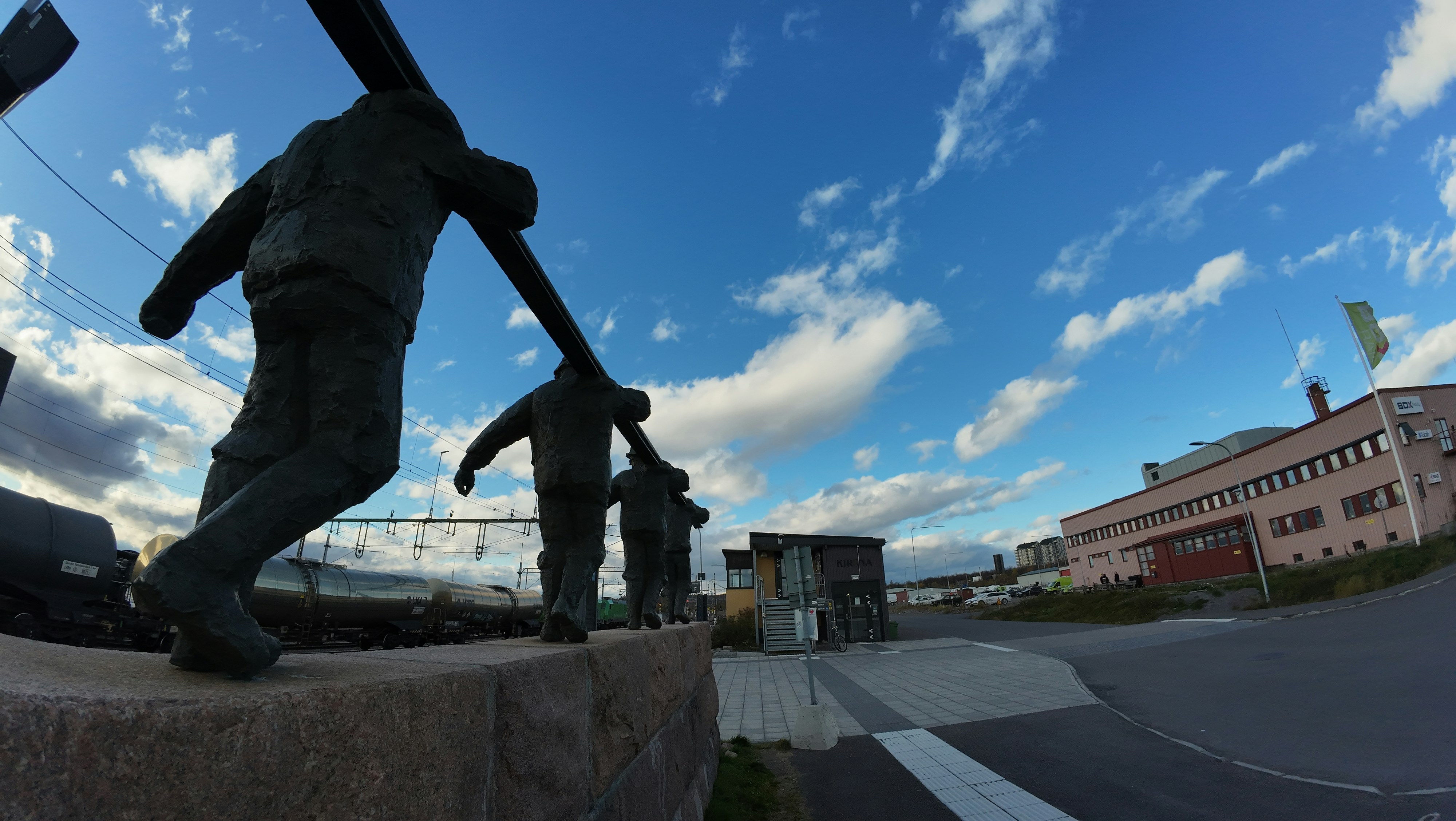 A statue of a man holding a baseball bat