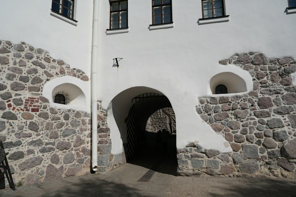 An arch through a granite-walled building — Vyborg, Russia