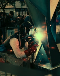 A welder working on a piece of metal