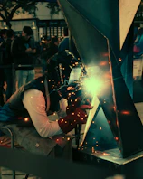 A welder working on a piece of metal