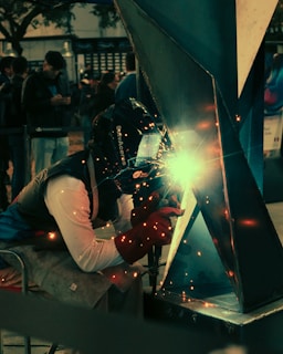 A welder working on a piece of metal