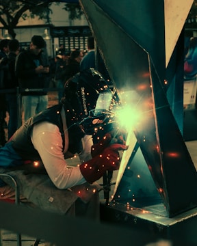 A welder working on a piece of metal