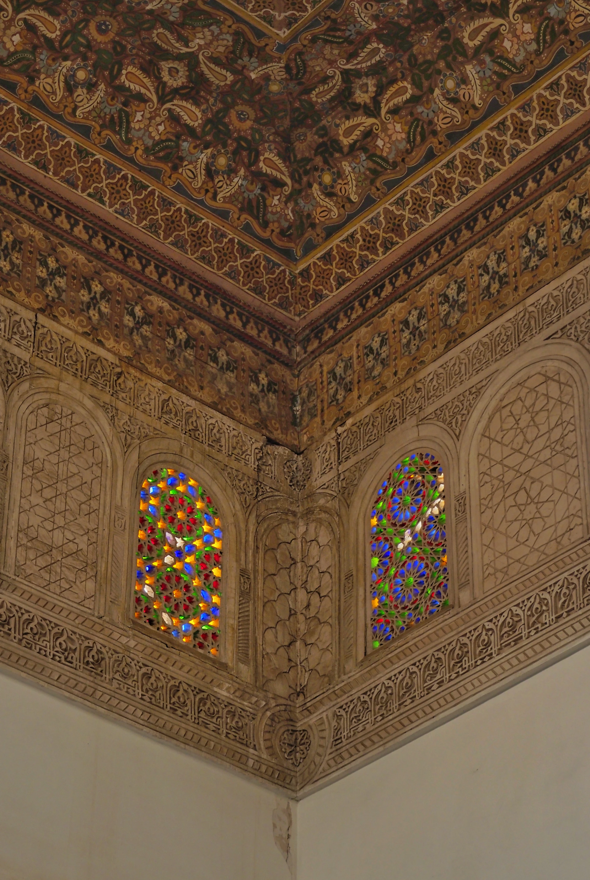 The ceiling of a building with stained glass windows
