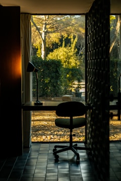 A room with a desk and a chair in it