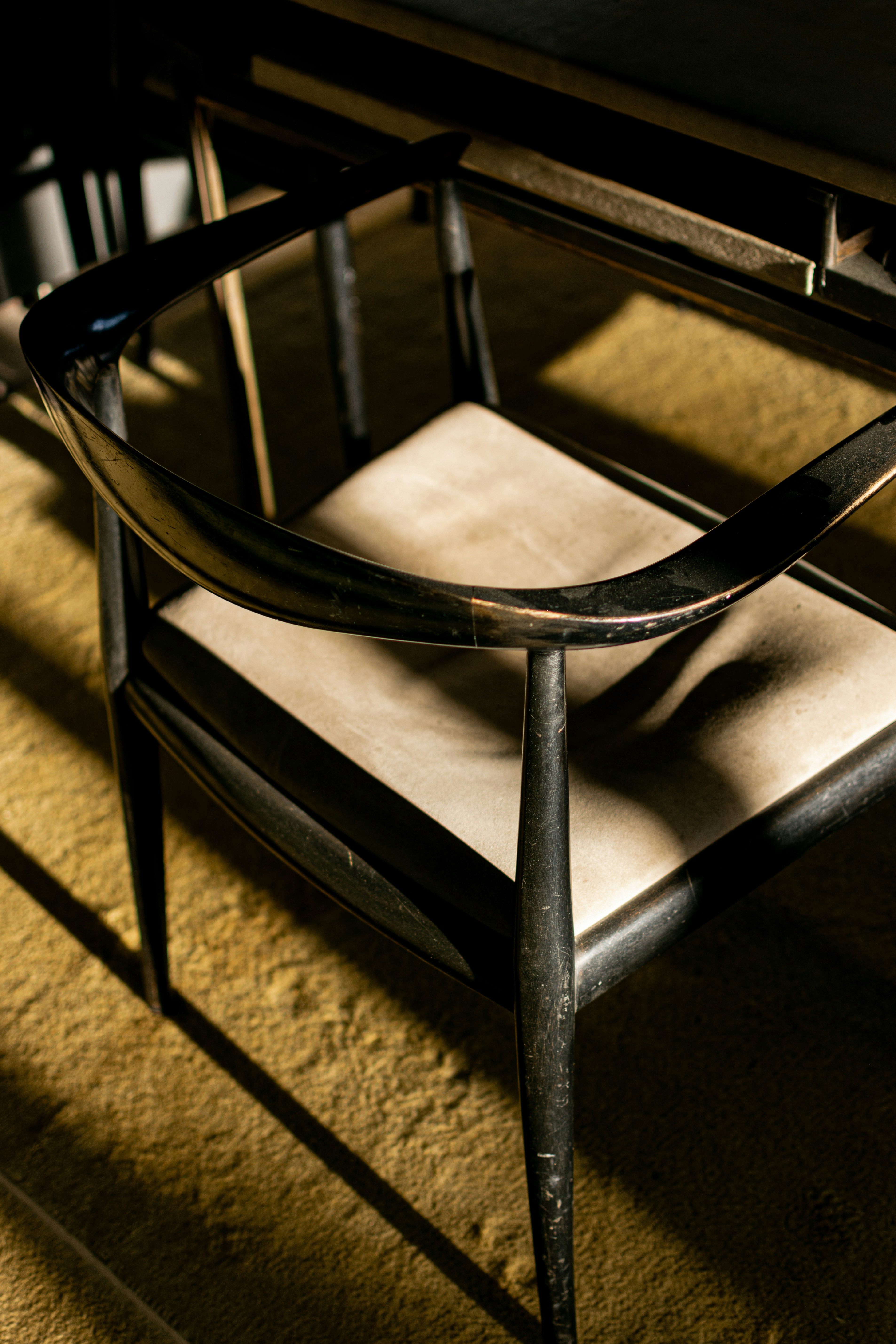 A table with a chair and a tray on top of it