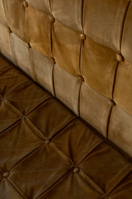 A close up of a brown leather couch