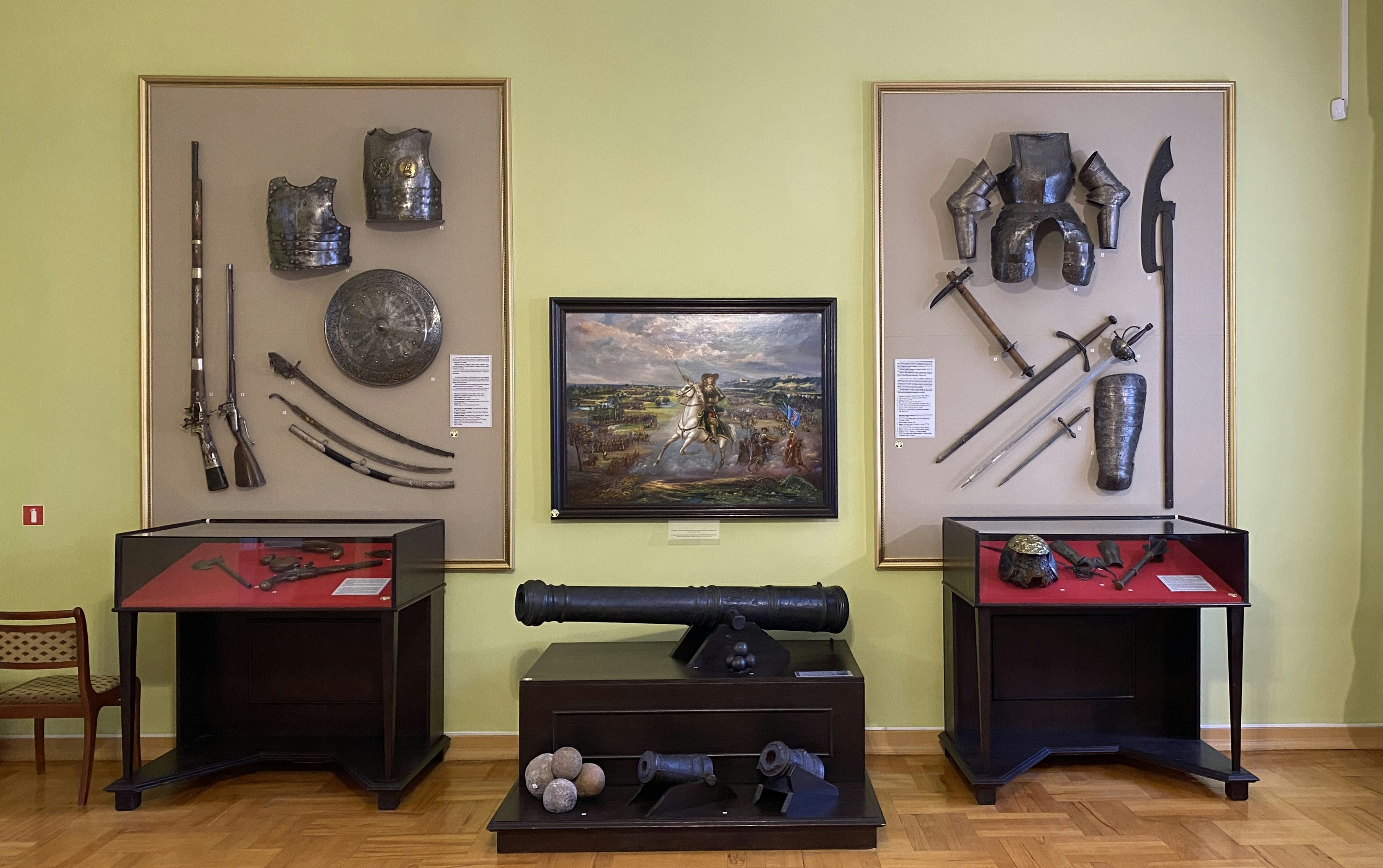 A room filled with furniture and paintings on the wall