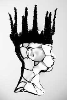 A black and white drawing of a woman's head