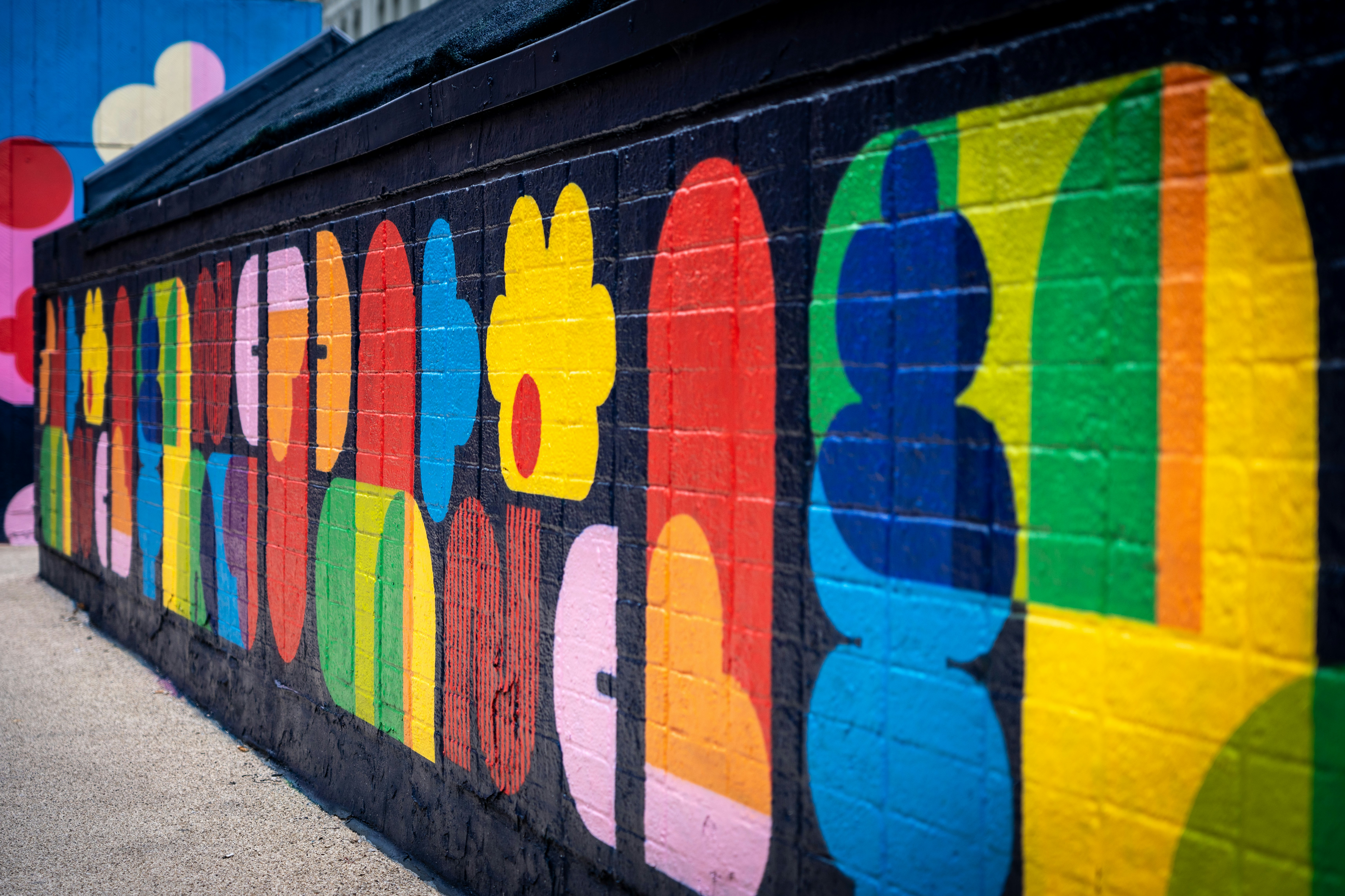 A colorful wall painted with a number of different colors