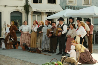 A group of people dressed in period clothing standing in front of a building