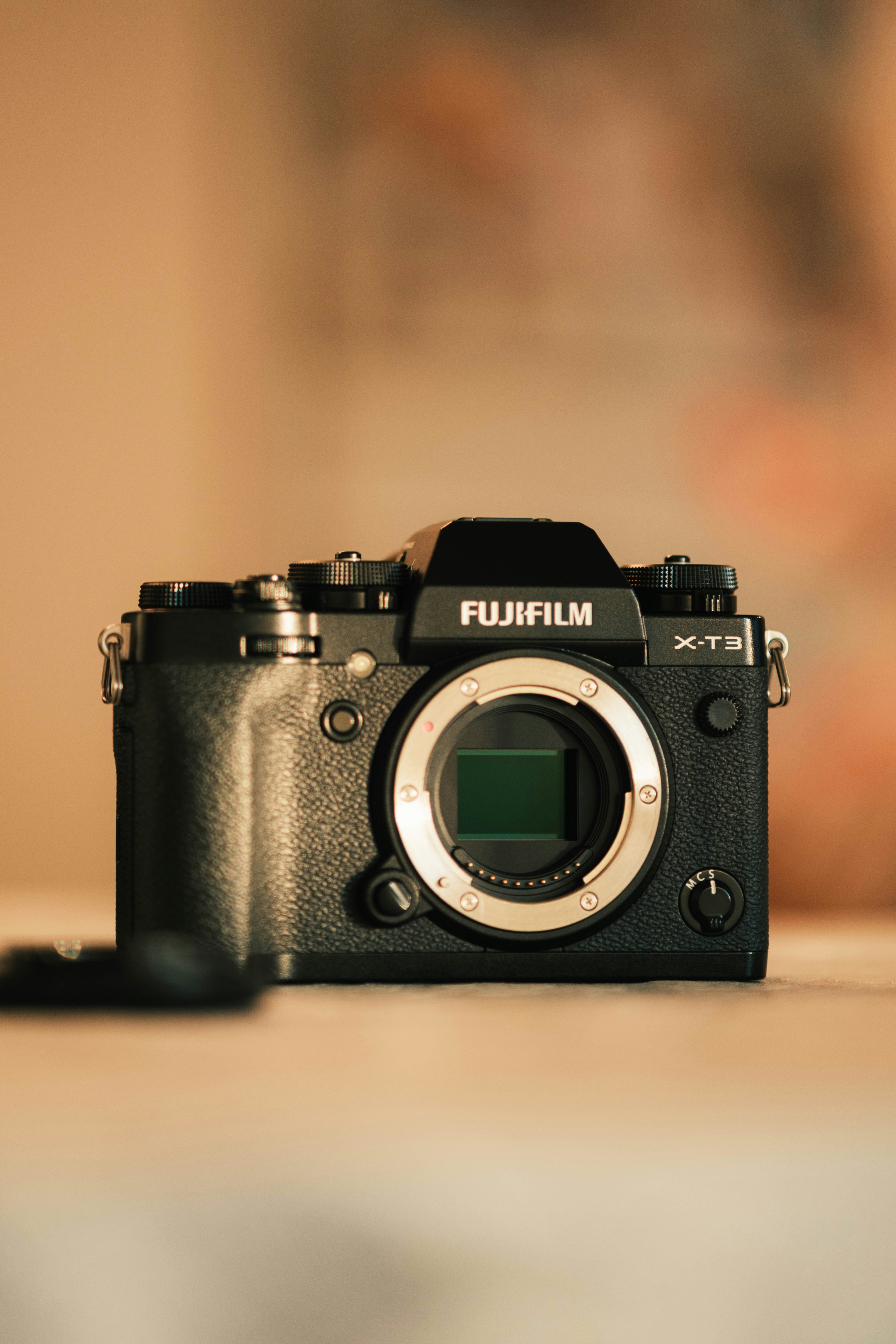 A black camera sitting on top of a table