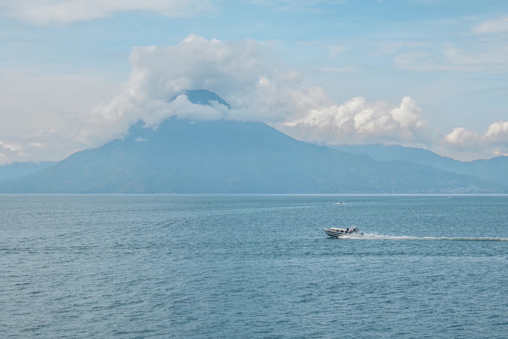 A boat traveling across a large body of water