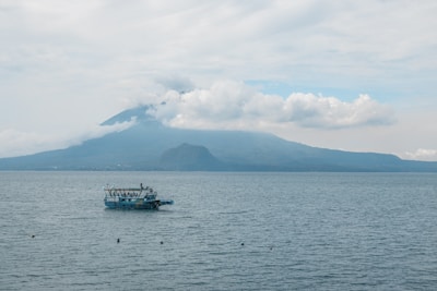 A boat floating on top of a large body of water