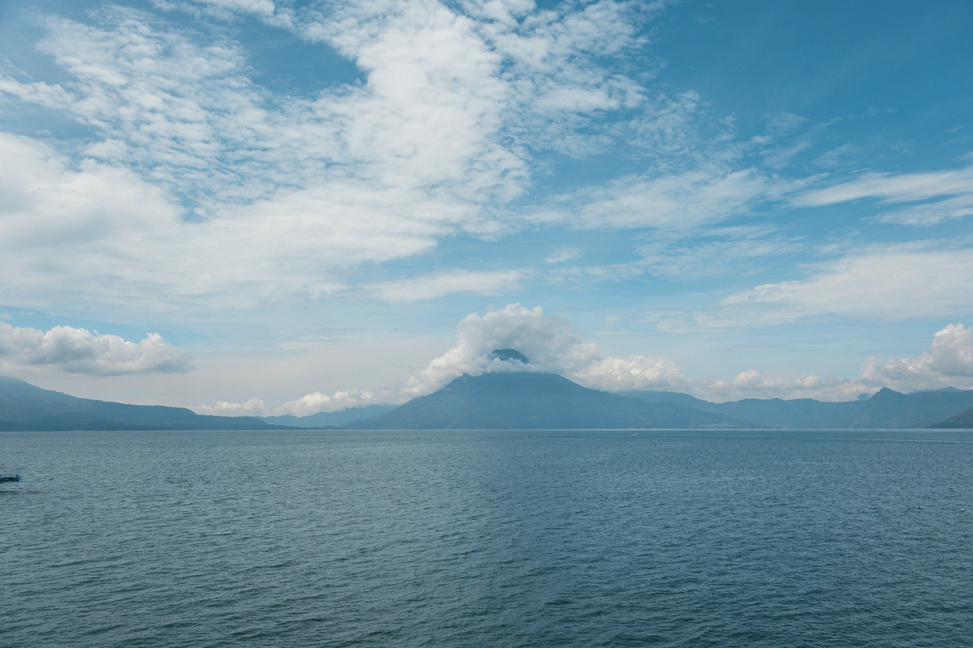 A boat floating on top of a large body of water