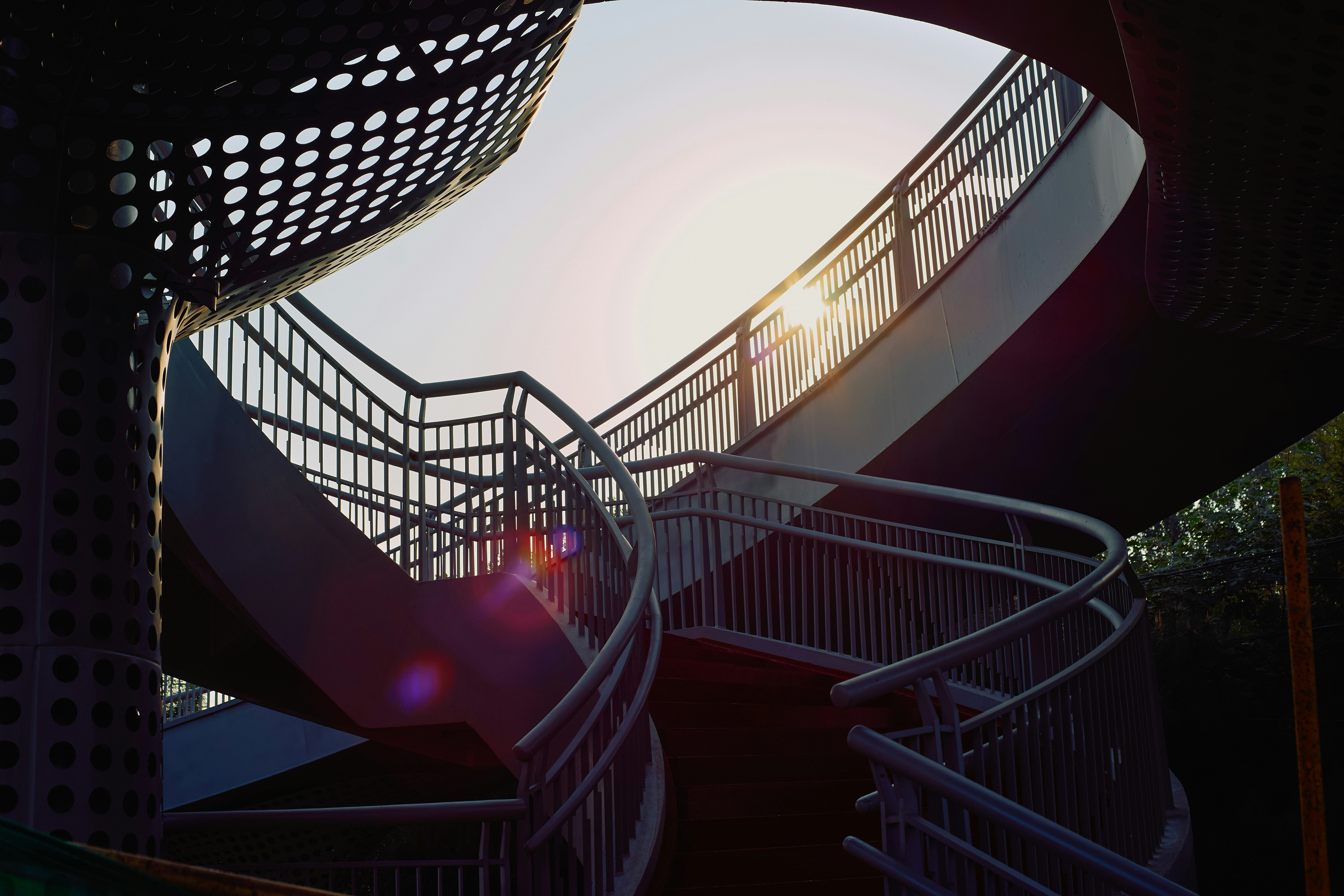 A set of stairs leading up to the top of a building