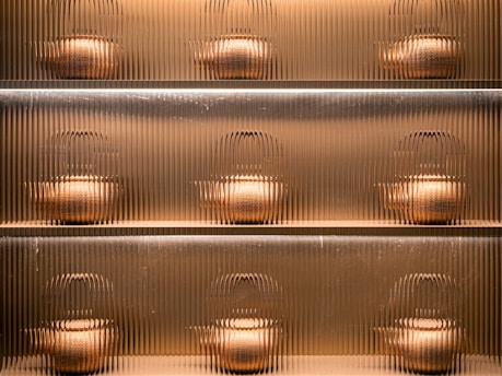 A metal shelf filled with lots of pots