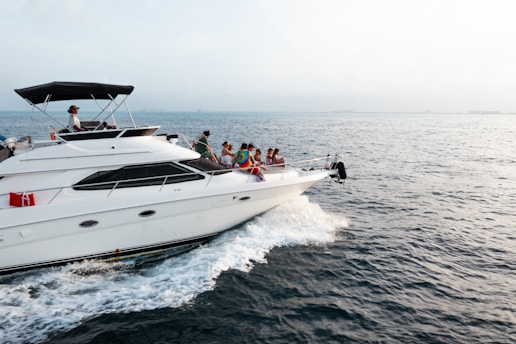 A large white boat with a lot of people on it