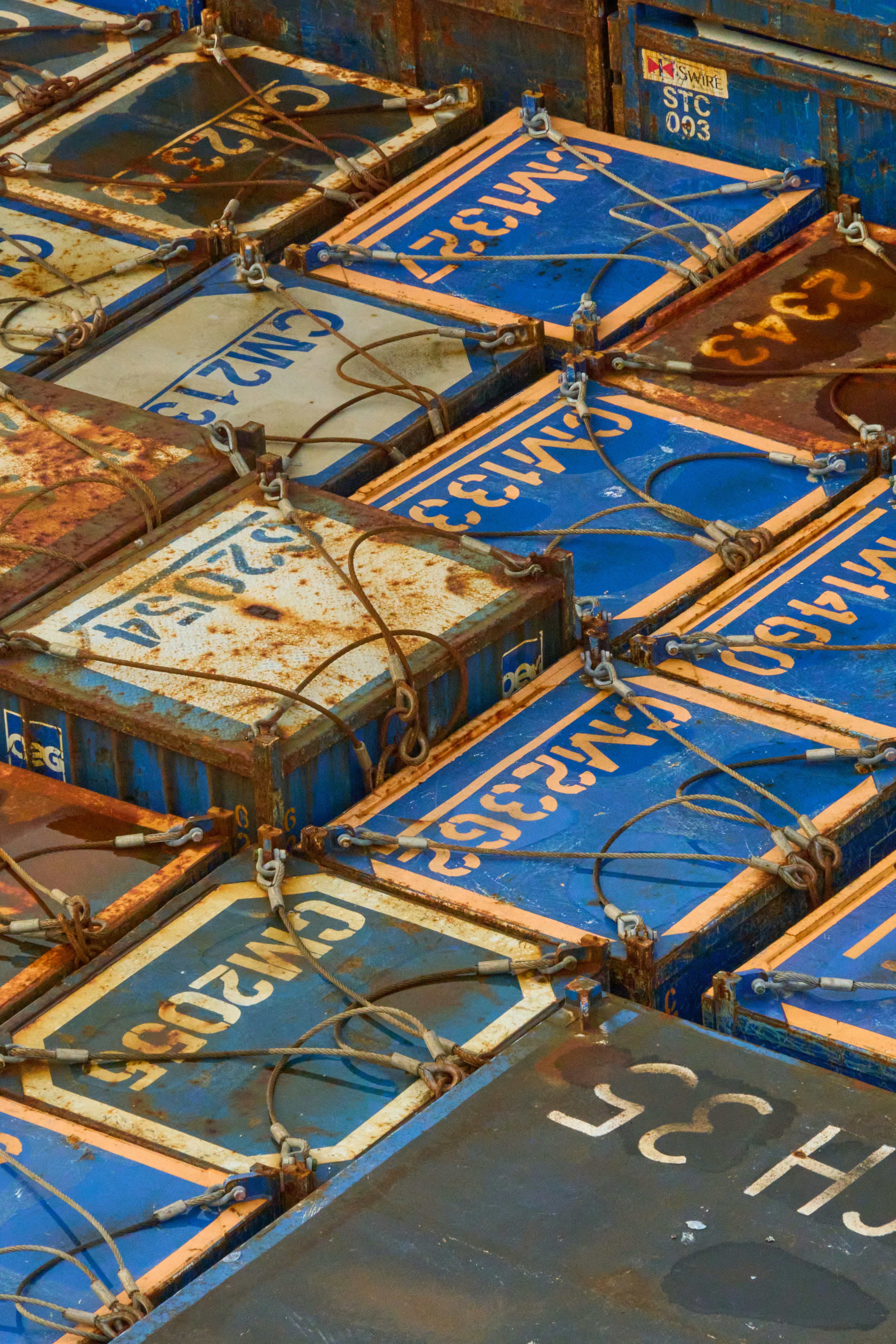 A pile of blue and brown signs sitting on top of each other