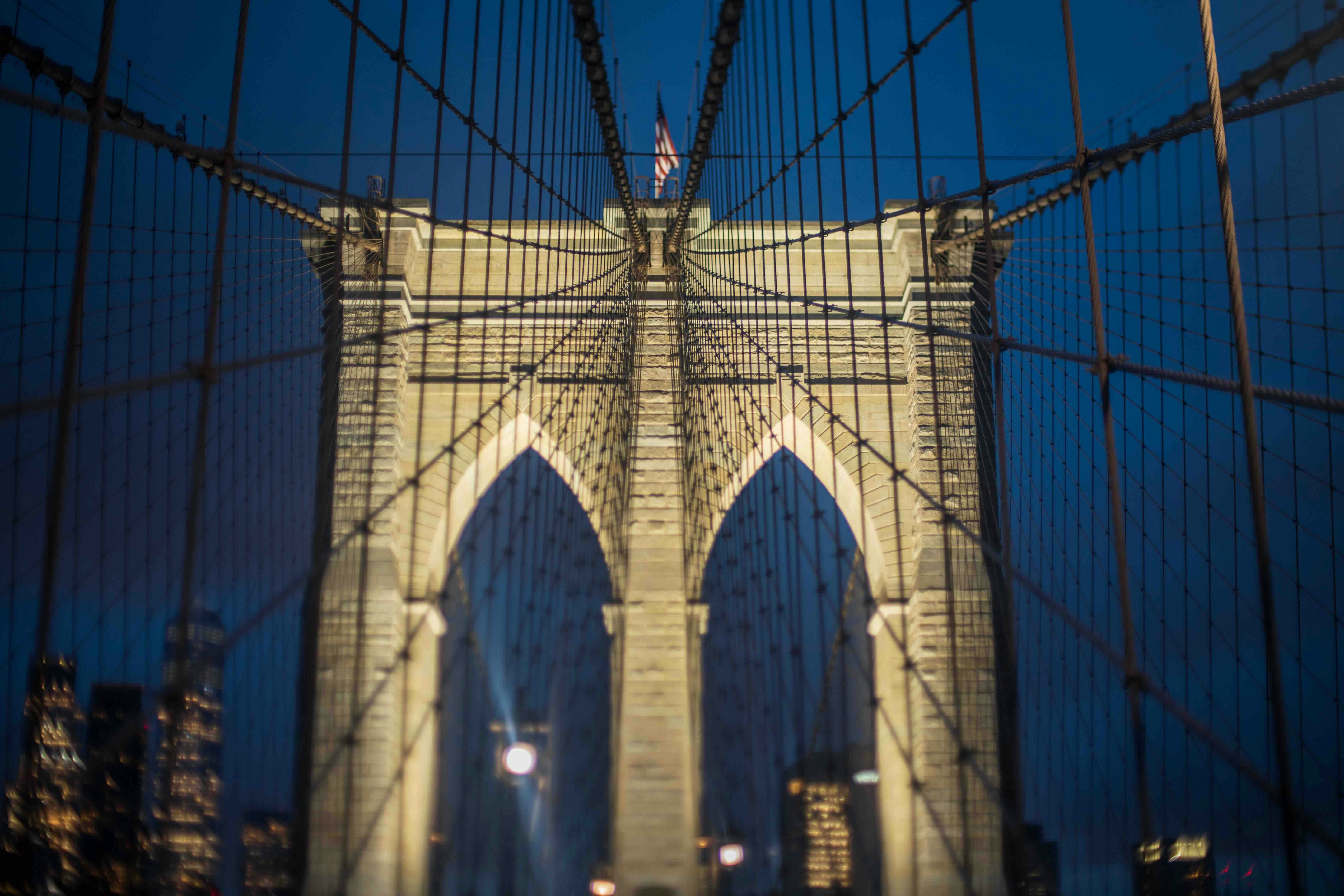 A view of the brooklyn bridge at night