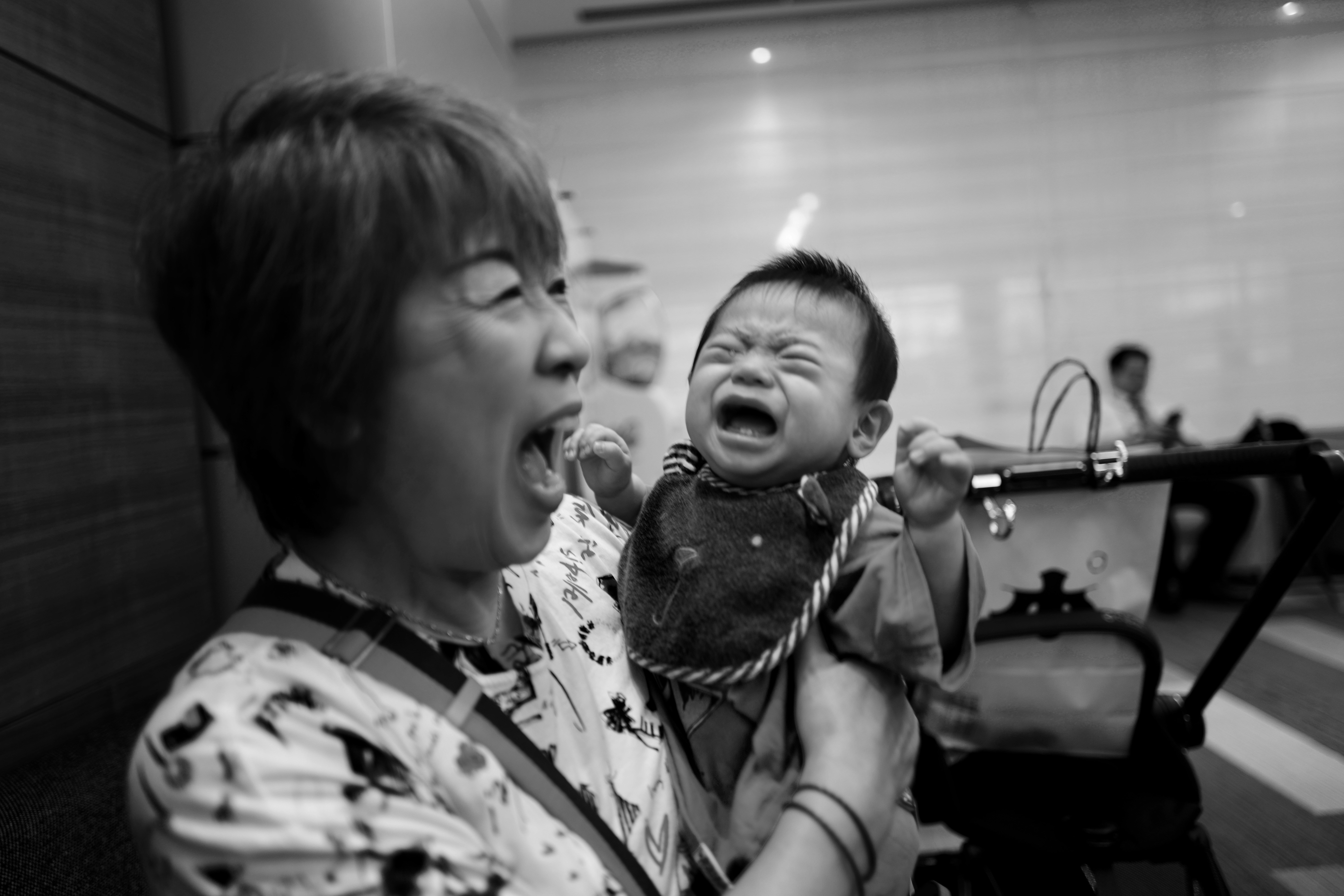 A woman holding a baby in her arms