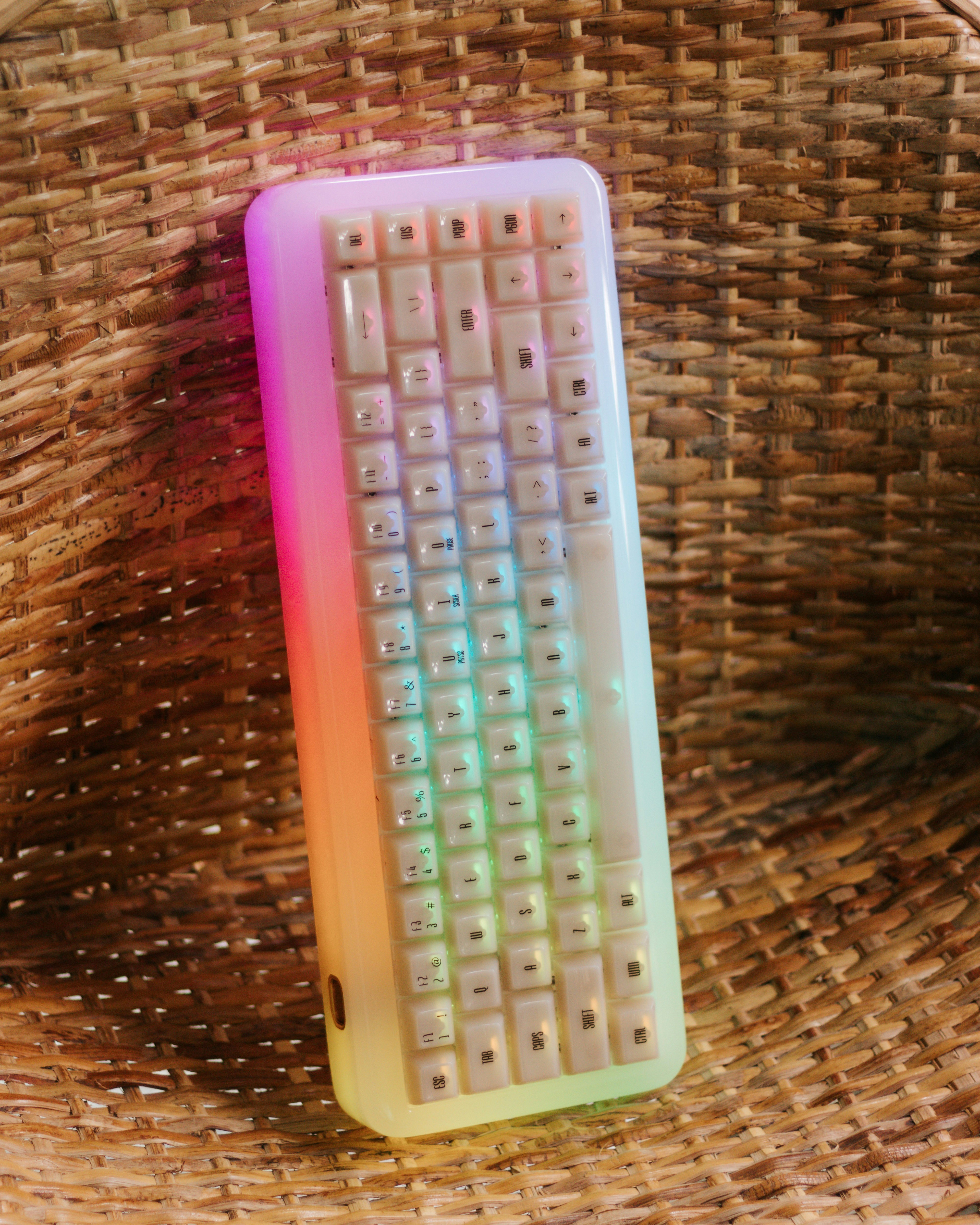 A keyboard sitting on top of a wicker basket