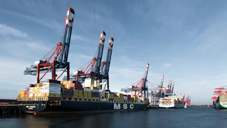A group of large ships sitting next to each other