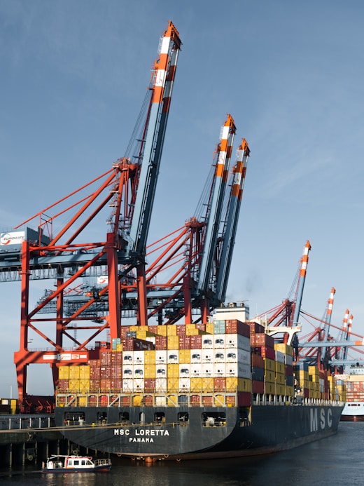 A large cargo ship docked at a dock