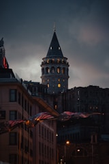 A very tall building with a clock on it's side
