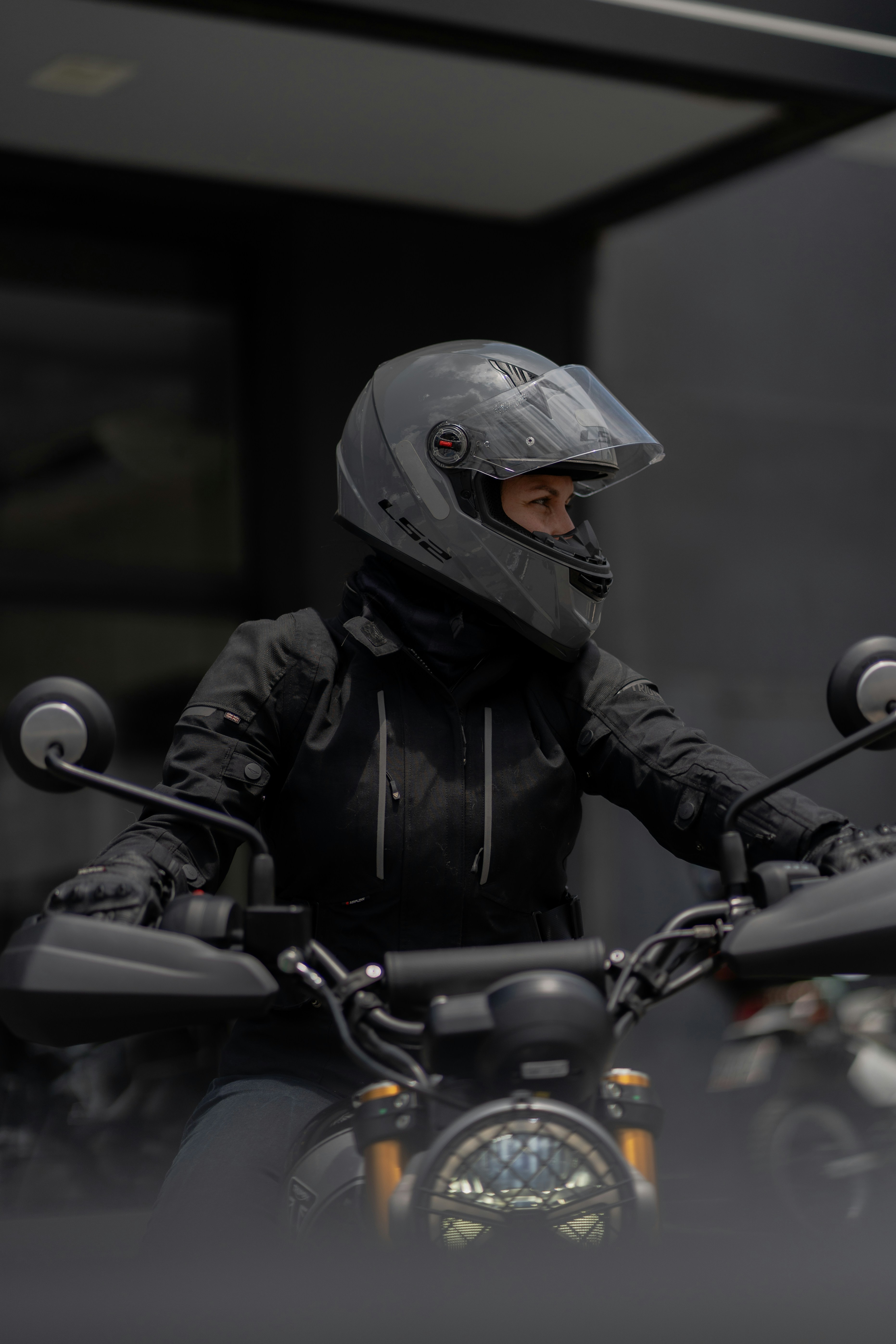 A man riding a motorcycle with a helmet on photo – Free Man Image on ...