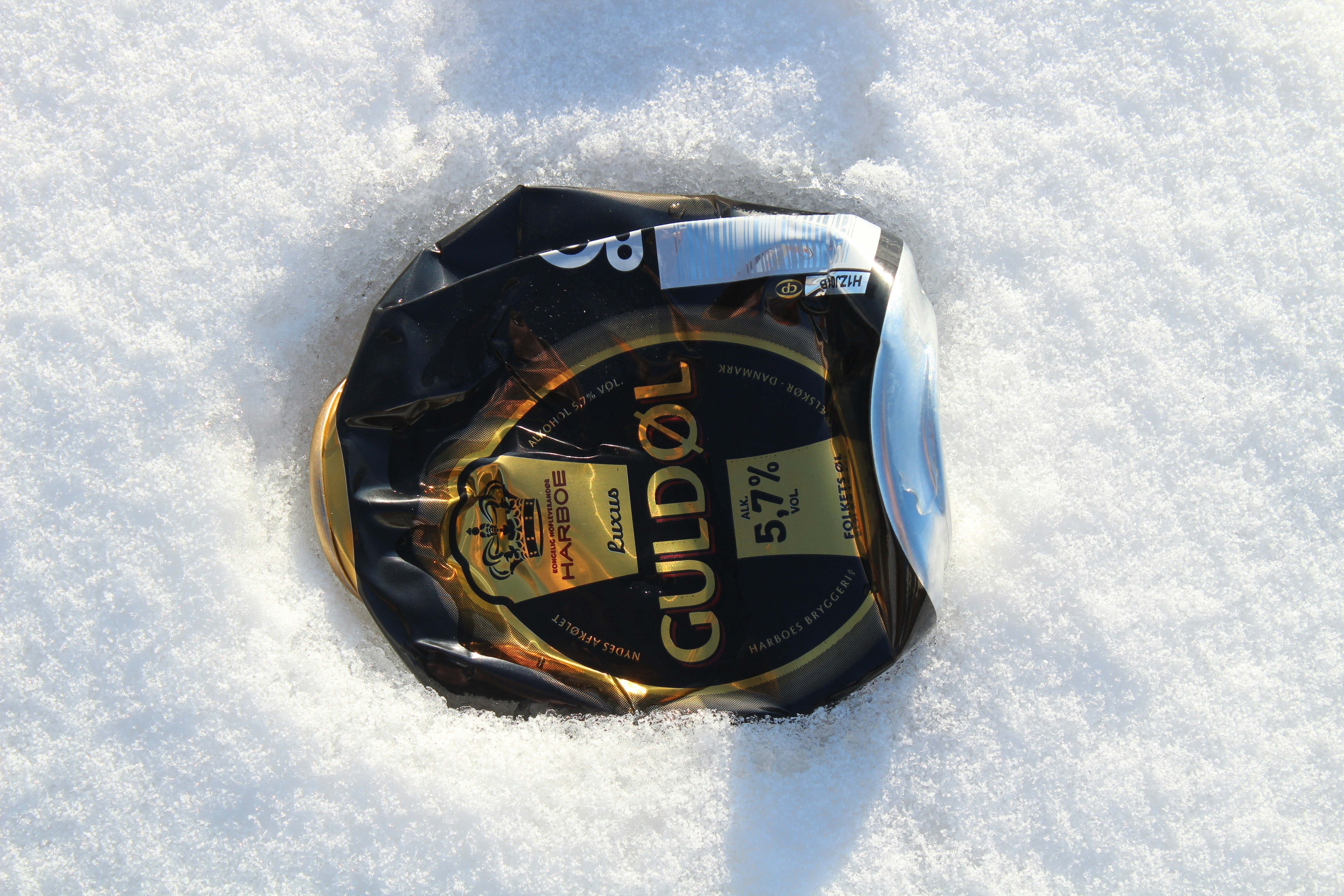 A pair of skis that are laying in the snow