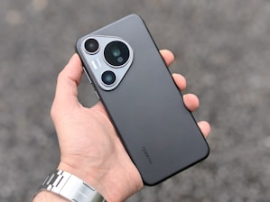 A person holding a cell phone in their hand
