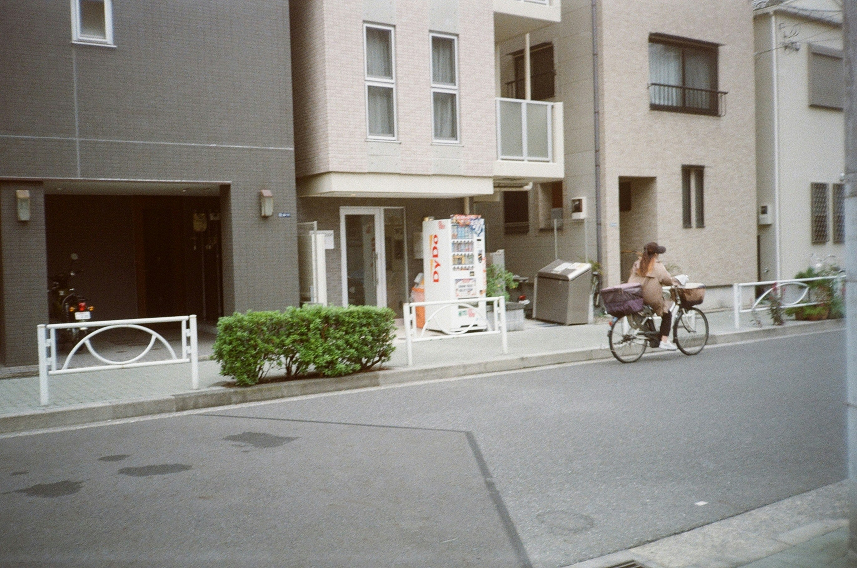 A person riding a bike down a street