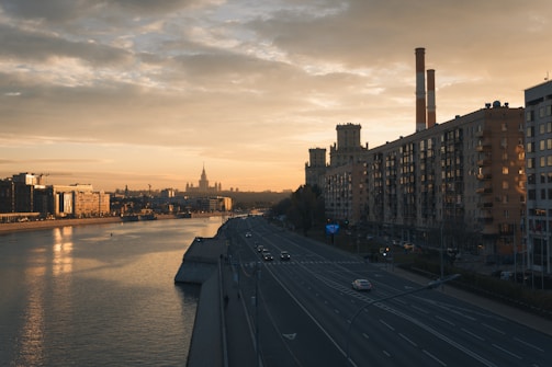 A river running through a city next to tall buildings