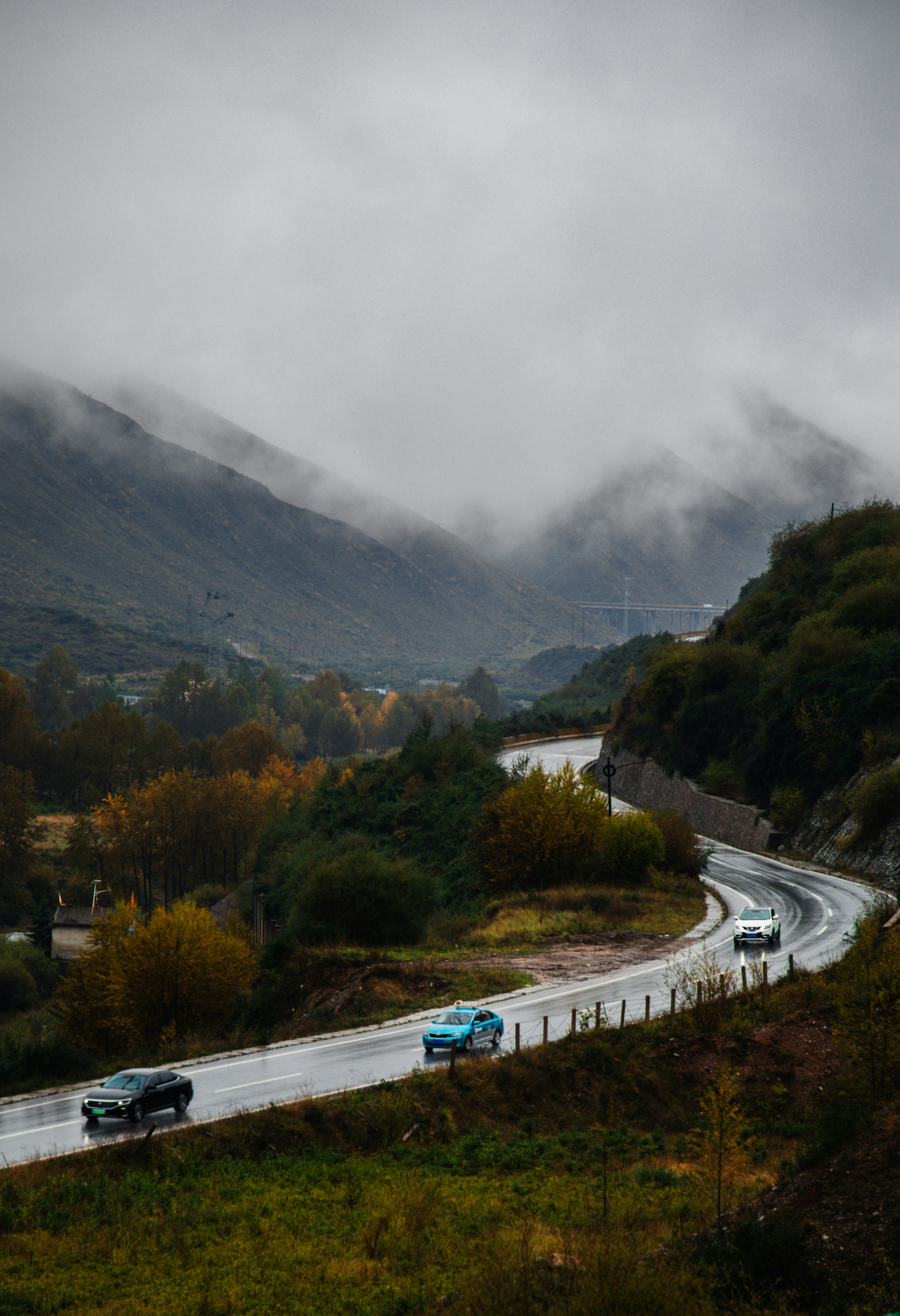 Cars driving on a road in the mountains