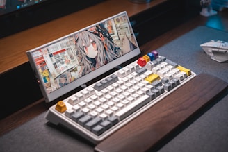 A laptop computer sitting on top of a wooden desk