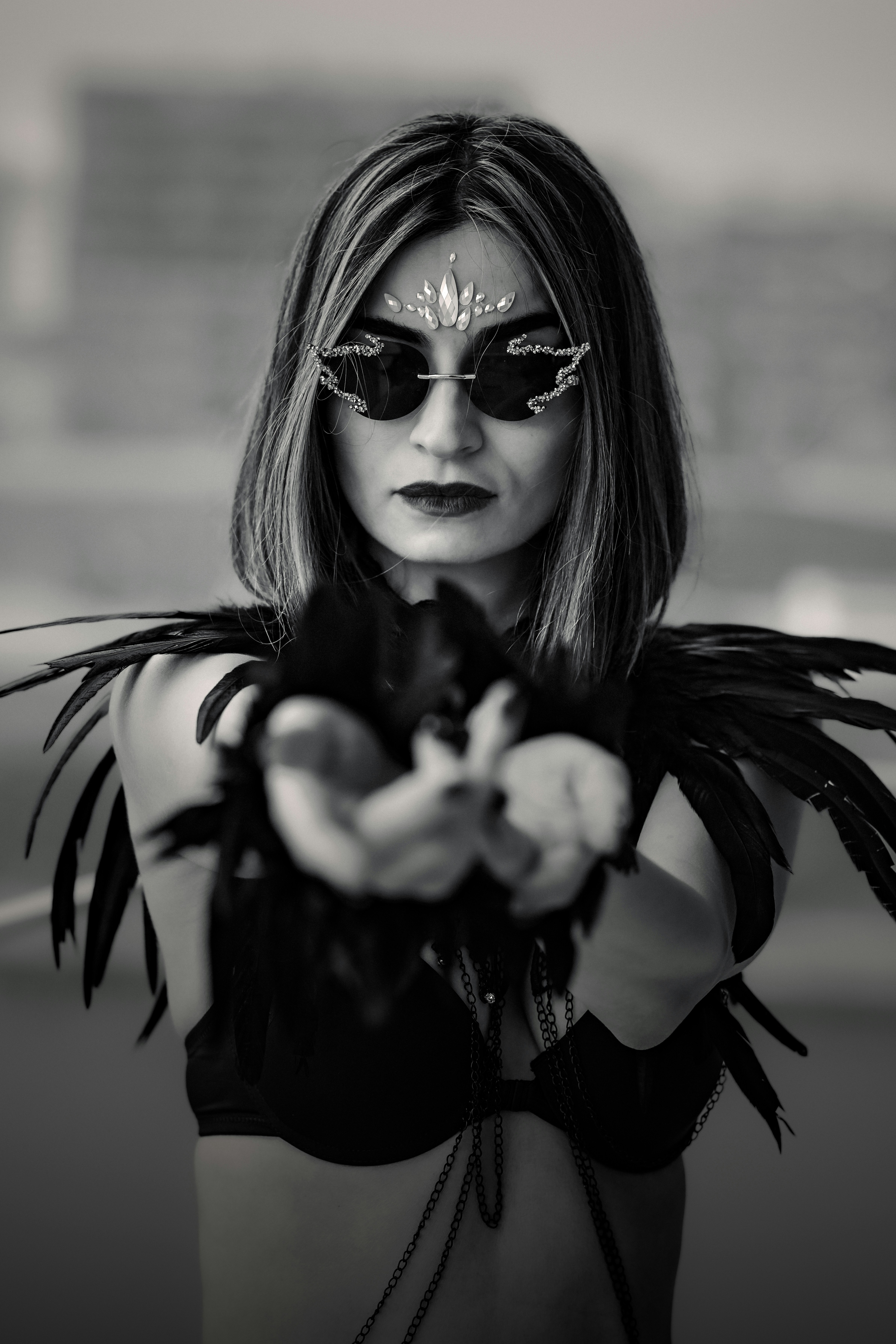 A woman in a black and white photo holding a gun